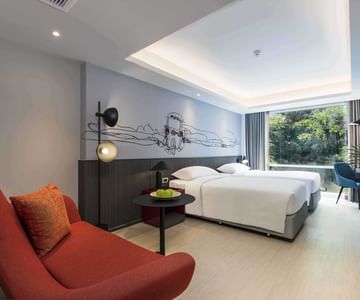 A room with two beds at Maitria Hotel Rama 9 Bangkok