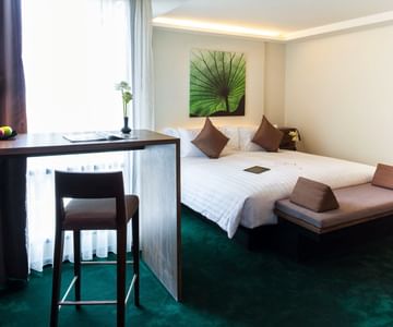 A room with one bed at Maitria Mode Sukhumvit 15