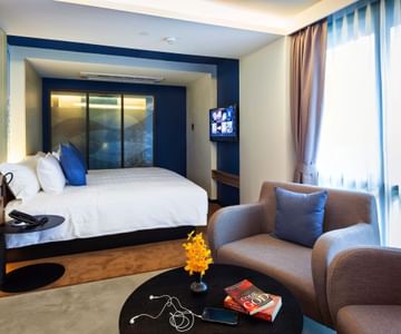 A room with one bed at Maitria Mode Sukhumvit 15