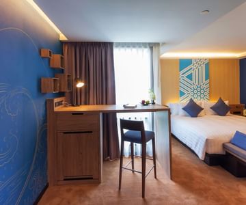 A room with one bed at Maitria Mode Sukhumvit 15