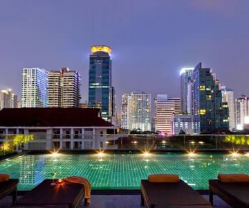 Night view of Rooftop pool at Maitria Mode Sukhumvit 15 Bangkok