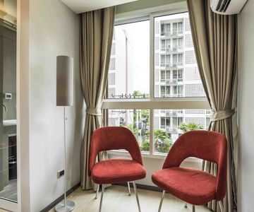 Two chairs in a Residence at Maitria Hotel Rama 9 Bangkok