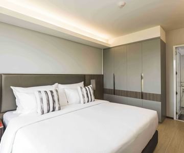 A room with one bed at Maitria Hotels & Residences